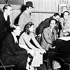 L to R: seated: Fred Astaire, Ginger Rogers, George Gershwin; standing: dance director Hermes Pan, film director Mark Sandrich, lyricist Ira Gershwin, and music director Nathaniel Shilkret (1936) 