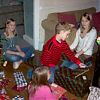 The grandchildren looking at Christmas presents which they received from their Granddad (Mr Wright)